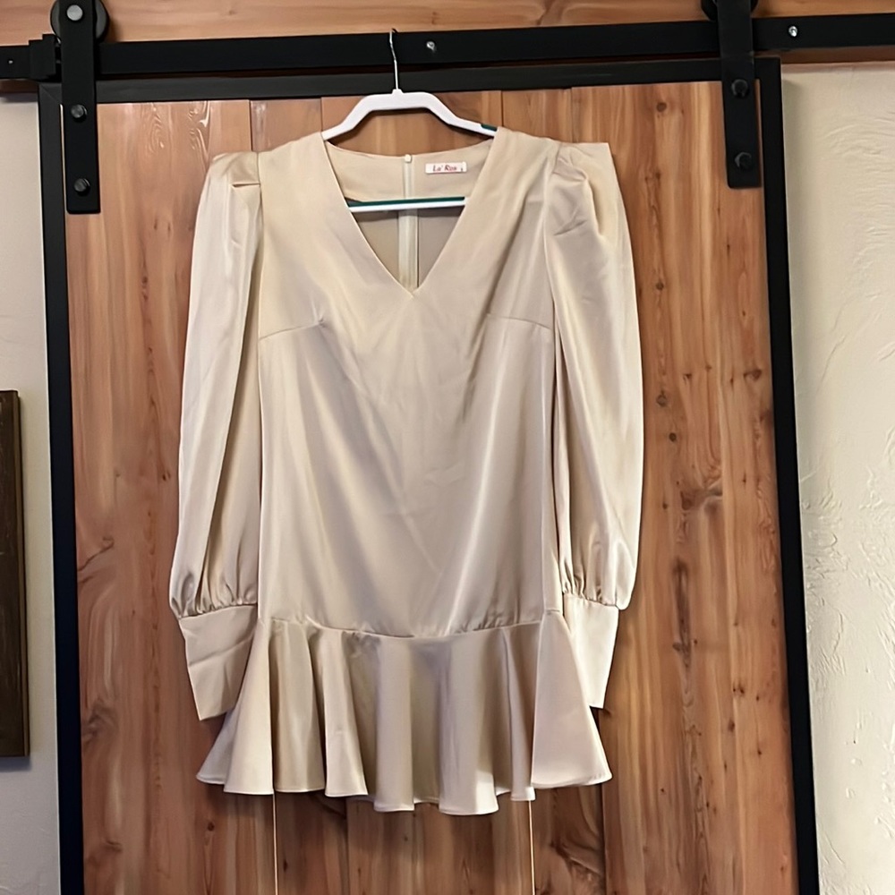 Really Cute Satin Look Champagne colored ruffled mini dress.